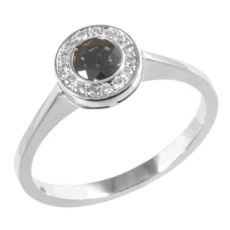 Кольцо из золота с бриллиантами и сапфиром