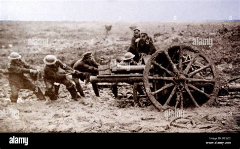 World war one British artillery gun is hauled through mud into a firing ...