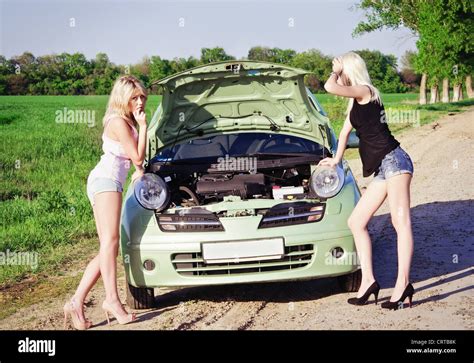 Two Sexy Blonde Girls Stand By The Broken Car And Don T Know What To Do Stock Photo Alamy