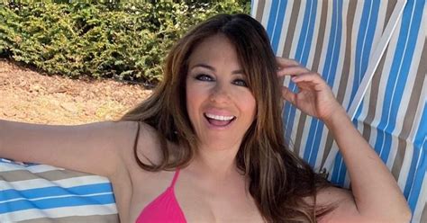 Liz Hurley Flaunts Sensational Curves As She Strips Down To Tiny Bikini