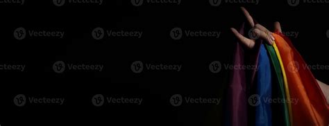 LGBTQ Pride Flag On Black Background Lgbt Rainbow Flag In Gay Hand 11833520 Stock Photo At