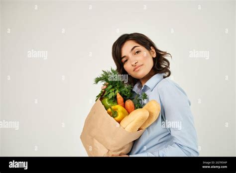 Brunette With A Package Of Groceries Healthy Food Vegetables Supermarket Stock Photo Alamy