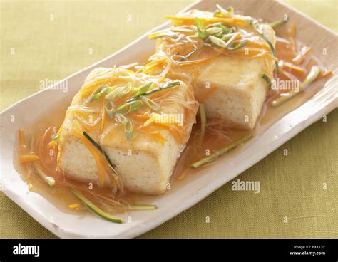 Fried tofu with vegetable sauce Stock Photo - Alamy