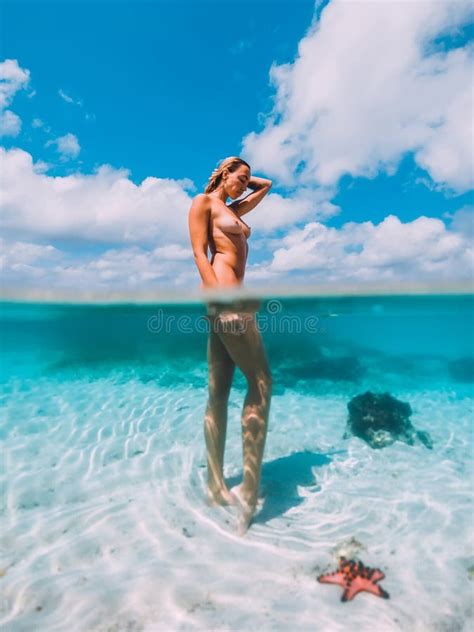 Naked Woman With Starfish Underwater Fifty Fifty Photo In Tropical Ocean Stock Photo Image Of