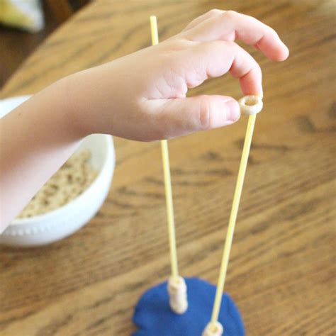 Cheerio Pencil Grasp Activity - Mom Life Made Easy