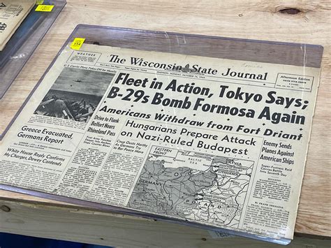 Readers look through the idaho state journal newspaper obituaries 4