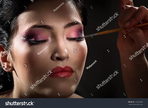 Sexy Brunette Putting Mascara Makeup Darkness Stock Photo