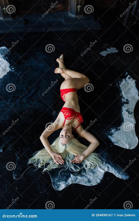 Fashion Model With Blond Hair Posing In Bedroom Wearing Red Lingerie Stock Image Image Of
