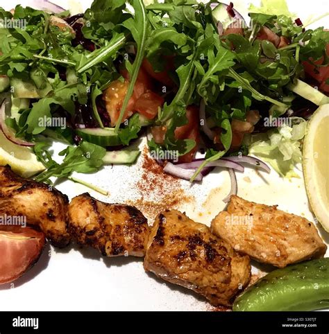 Turkish chicken shish kebab & salad Stock Photo - Alamy