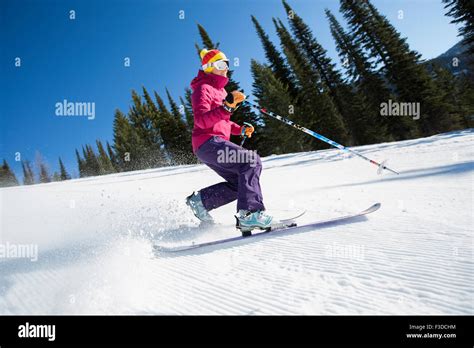 Woman Skiing Downhill Stock Photo Alamy