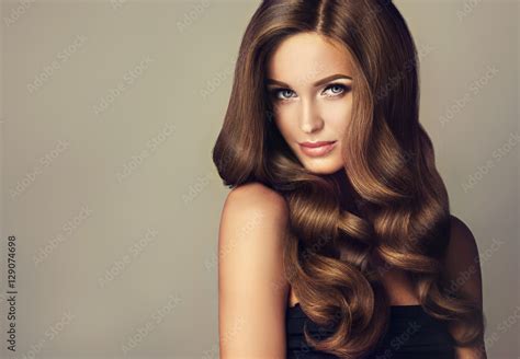 Beautiful Model Girl With Long Wavy And Shiny Hair Brunette Woman With Curly Hairstyle Stock