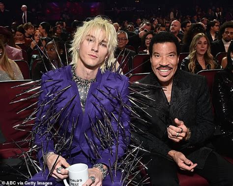 Machine Gun Kelly Looks Sharp In Purple Suit Covered In Black Spikes