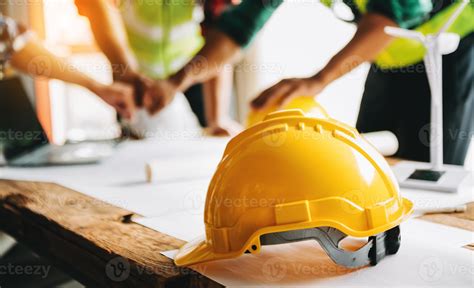 Engineer teams meeting working together wear worker helmets hardhat on ...