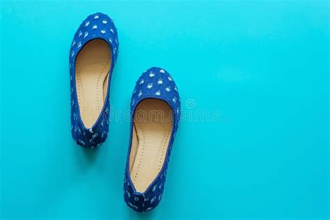 Vintage Blue Pair Of Polka Dot Shoes On A Blue Background Stock Image
