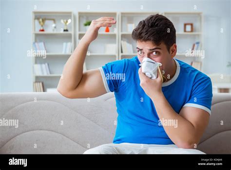 Man Sweating Excessively Smelling Bad At Home Stock Photo Alamy