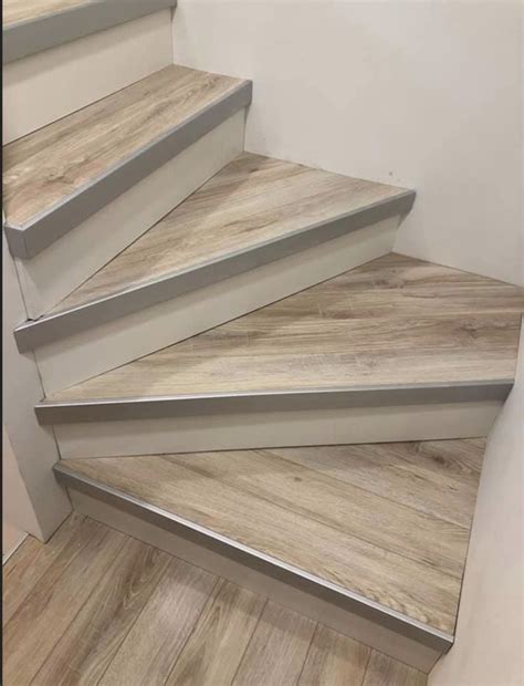 The Stairs Are Made Of Wood And Have White Painted Treads On Each One Side