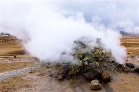Premium Photo Steam Emitting From Hot Spring At Hverir