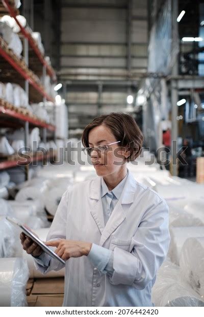 Portrait Female Factory Worker Wearing Glasses Stock Photo 2076442420