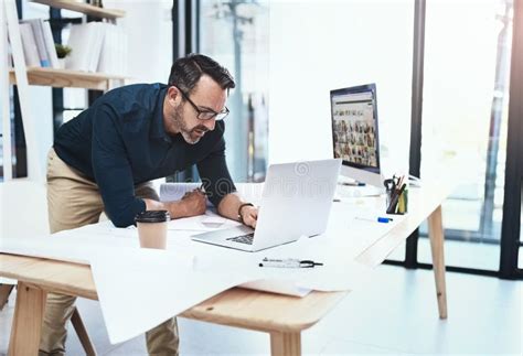 Trying To Build His Business A Mature Male Architect Working On His