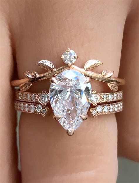 Pear Shaped Diamond Engagement Ring Set With Crown And Leaf Bands Ken