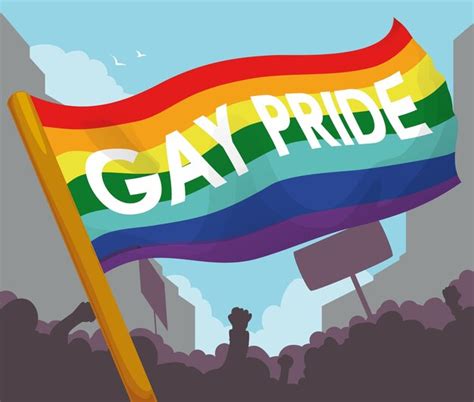 Bandeira do arco íris em uma manifestação durante o orgulho gay Vetor Premium