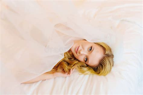 Morning Of The Bride Delicate And Beautiful Blonde Bride In Bed Under Veil Stock Photo Image