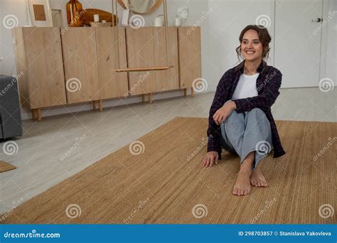 Beautiful Brunette Woman In Shirt And Jeans Barefoot At Home On Floor Stock Image Image Of