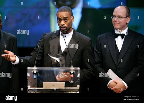 U S World Champion Sprinter Tyson Gay Holds His Athlete Of The Year Award As He Speaks Sunday