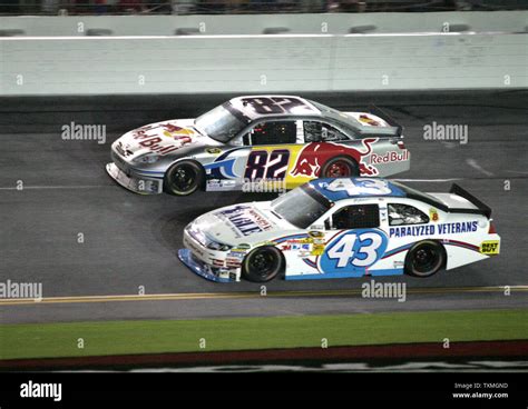 Aj Allmendinger 43 Passes Scott Speed 82 On The Front Stretch During The Nascar Sprint Cup