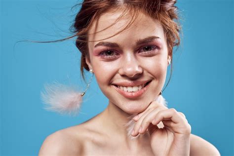 Premium Photo Woman With Bright Makeup On Face Naked Shoulders Luxury Blue Background