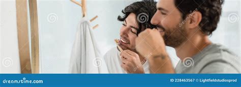 Happy Gay Couple Brushing Teeth In Stock Image Image Of Indoors