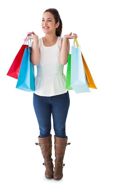 Premium Photo Happy Brunette Posing With Shopping Bags