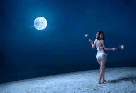 Premium Photo Asian Sexy Girl In Bikini Holding Fireworks On The Beach At Night
