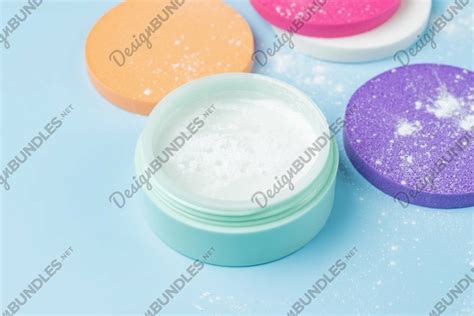 Mineral loose powder in a green plastic container
