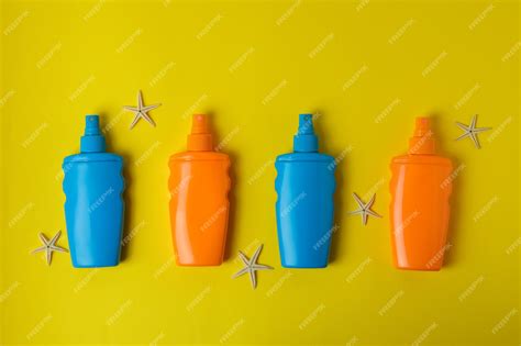 Premium Photo Bottles Of Sunscreen And Starfishes On Yellow