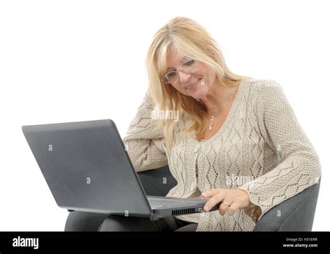 A Portrait Of A Smiling Mature Woman Using Laptop Stock Photo Alamy