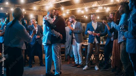 Handsome Happy Gay Couple Celebrate Wedding At An Evening Reception Party With Diverse