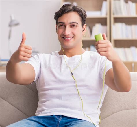 Man Listening Music Sitting In Couch Stock Image Image Of Playing