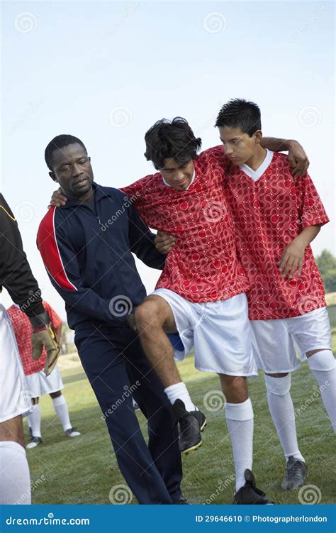 Teammates Carrying Injured Soccer Player Stock Photo Image Of Injured