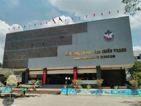 A Large Building With Flags Flying In The Background