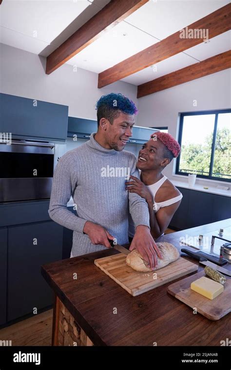 Gay Couple In Kitchen Stock Photo Alamy