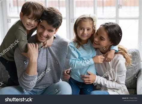 happy adorable small children cuddling affectionate stock photo edit