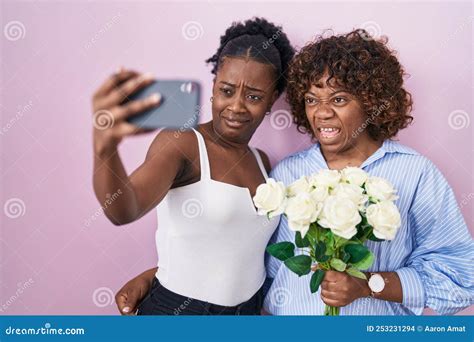 Photo Of Confused Half Naked Man Looking At Camera And Holding Orange Royalty Free Stock