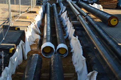 Installation Of Hot Water Pipes For Heating Apartments Insulated Pipes Are Laid In The Road For