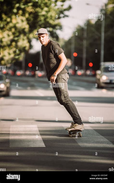 Pro skateboarder ride skateboard on the capital city road streets ...
