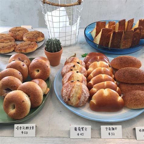 Various Types Of Breads And Pastries Displayed On Plates