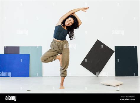 Beautiful Brunette Woman Engaged In Yoga Asana Gymnastics Flexibility Stock Photo Alamy