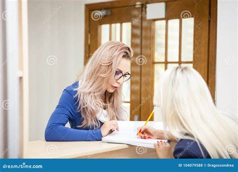 Business Lady With Her Blonde Secretary In The Waiting Area Of A Stock Photo Image Of