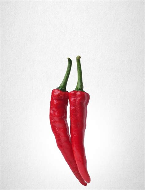 Premium Photo Close Up Of Red Chili Pepper Against White Background