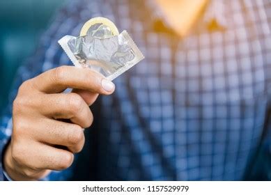 Male Hand Holding Condom Safe Sex Foto Stock Shutterstock